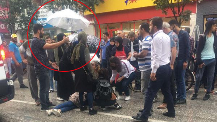 Kaza geçiren genç kıza şemsiyeli koruma