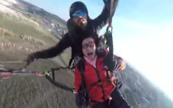 Çinli kadın yamaç paraşütü yaparken gökyüzünde bayıldı