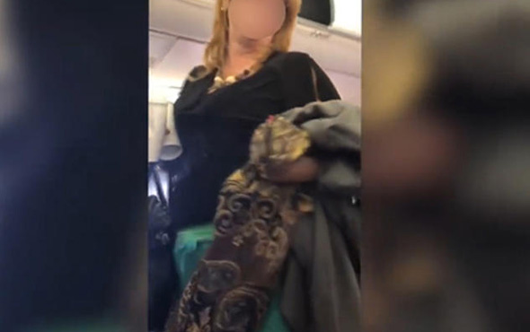 Yolcu uçağında ırkçı kadın yolcu terör estirdi