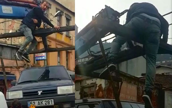 Çekicinin üstünde 3 kilometre yol gitti görenler şaşkına döndü