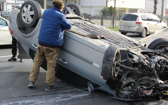 Takla atan otomobilden sağ kurtuldu