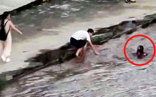 Nehirde boğulmak üzere olan çocuğu son anda kurtardı