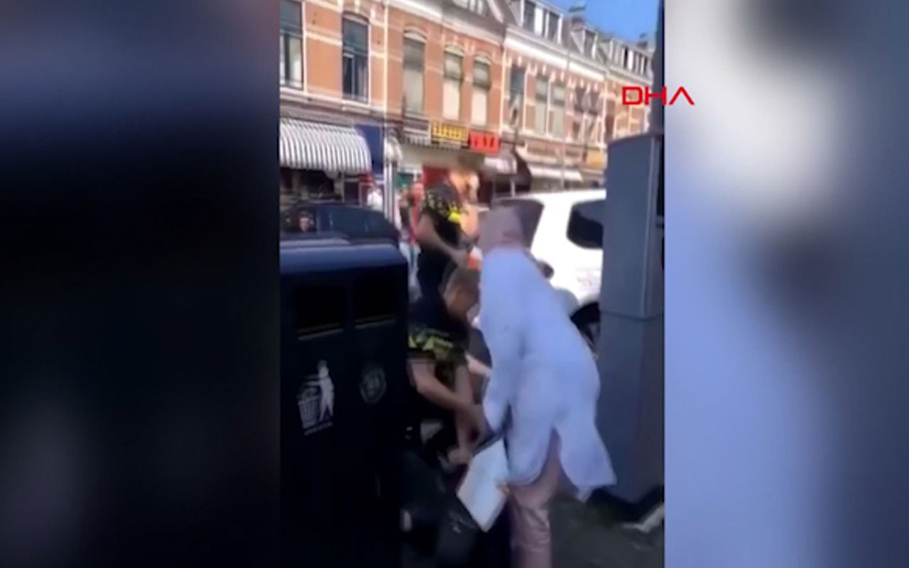 Hollandalı polisten başörtülü kadına tekme tokat dayak! O anlar saniye saniye kaydedildi