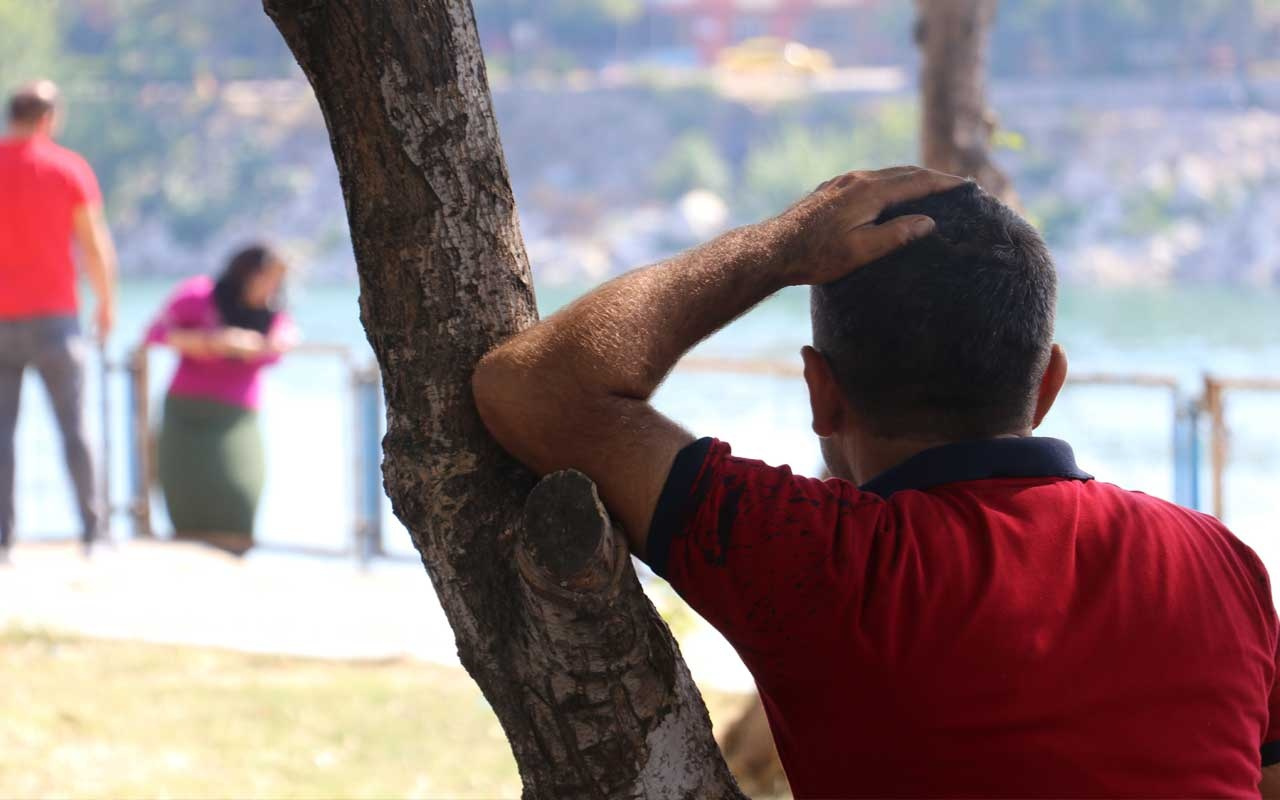 Adana'da intihara teşebbüs eden kadını kocası ağaca yaslanarak izledi