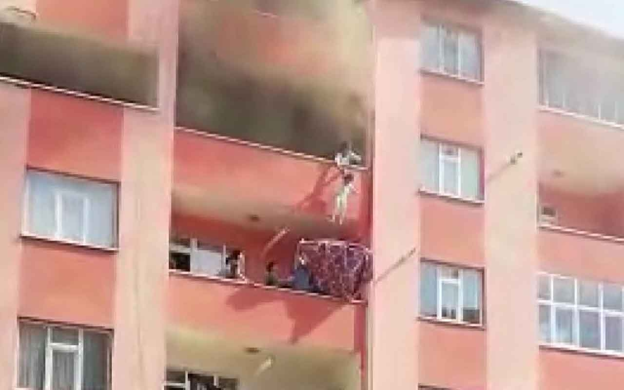 Ağrı'da yangında çocuklarını komşusunun balkonuna sarkıtarak kurtardı