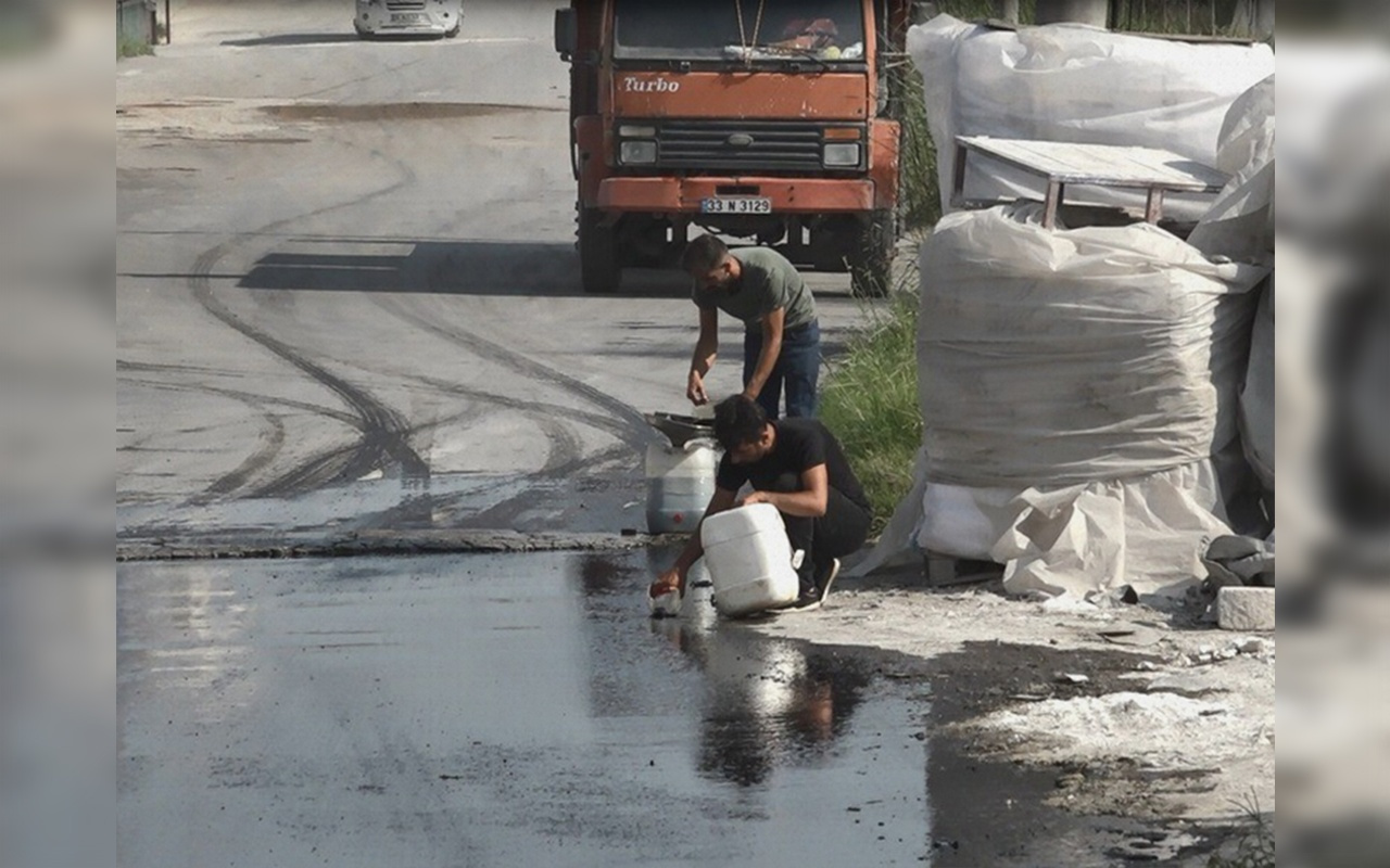 Mersin'de vatandaşlar kaza yapan tankerden akan mazotu götürdü
