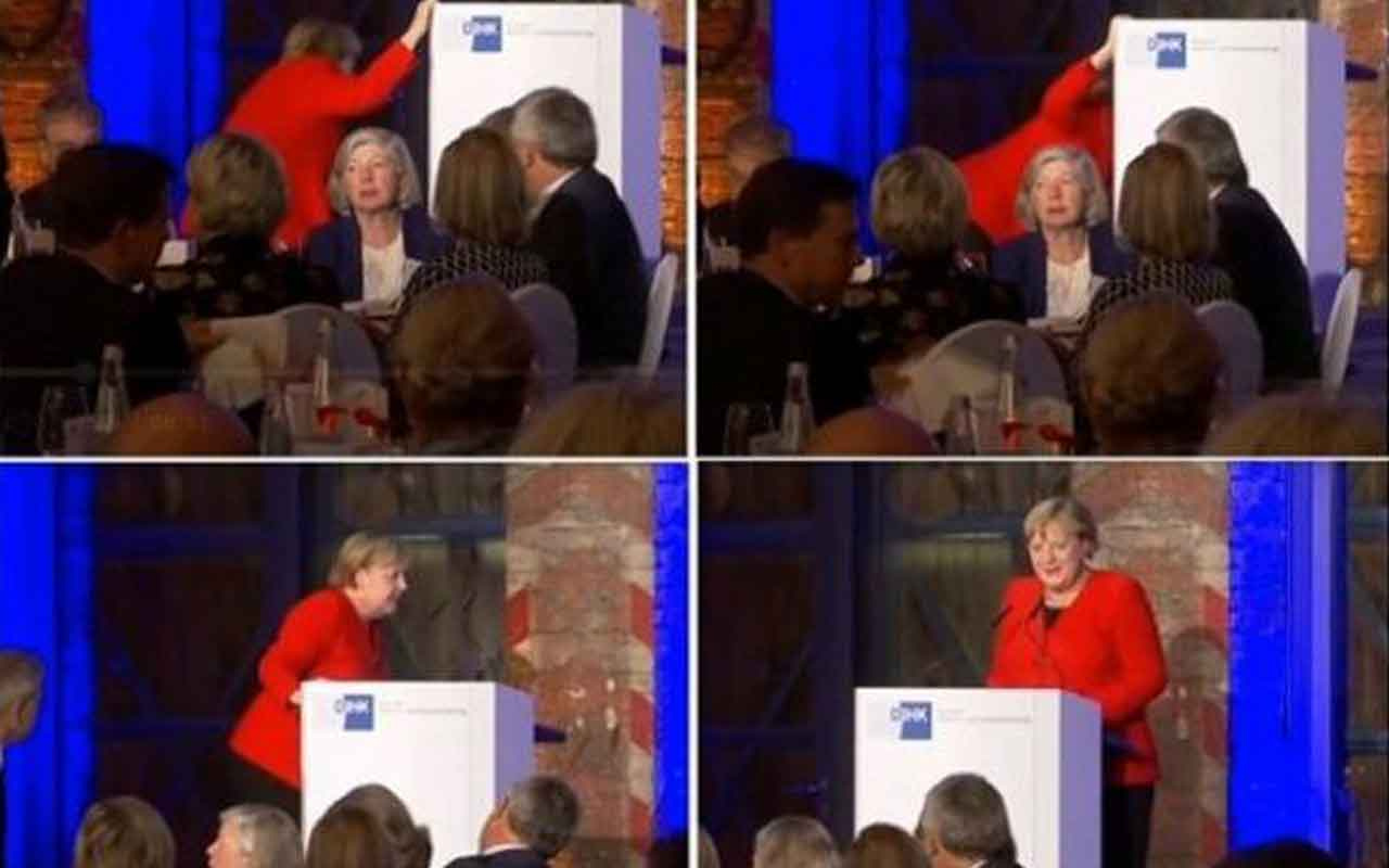 Angela Merkel az kalsın düşüyordu tutunarak kendini kurtardı