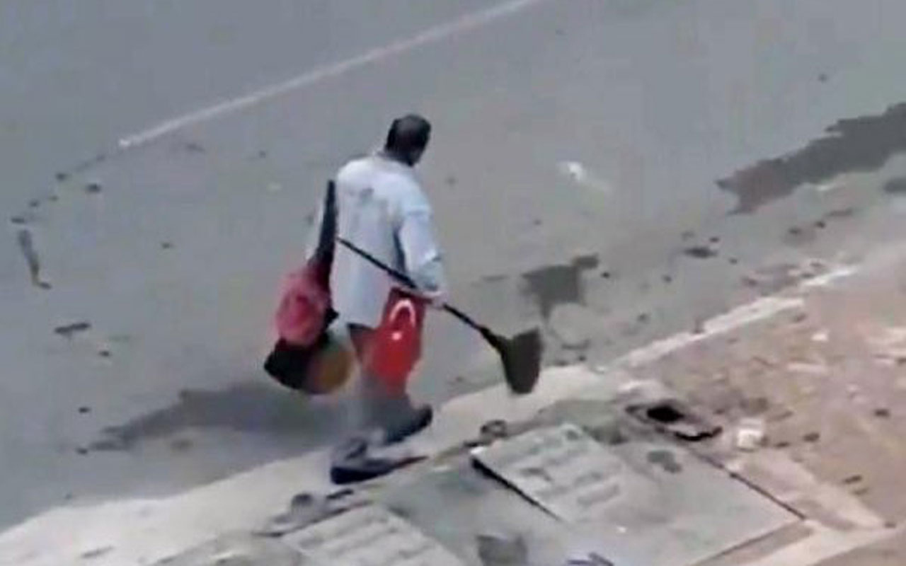 Yolda bulduğu Türk bayrağını süpürgesinin sapına takan işçiye ödül
