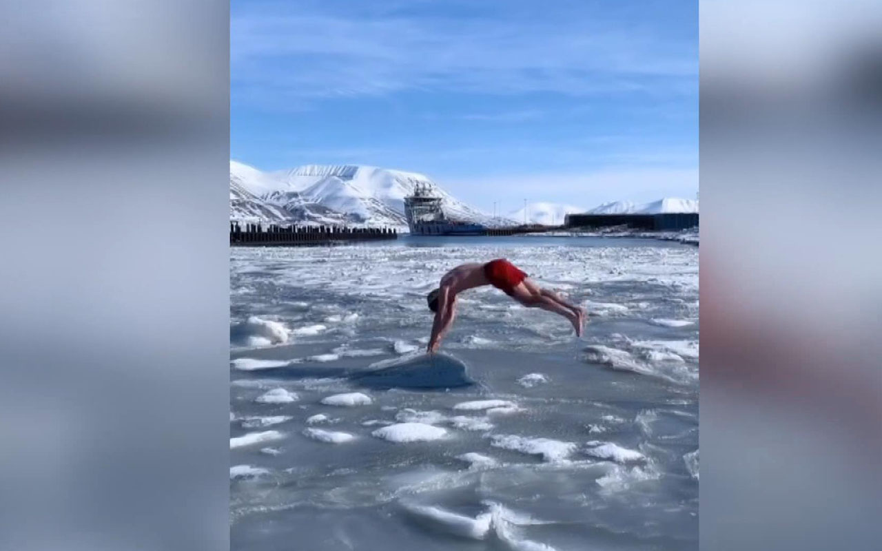 Buzullara aldırmadan şortuyla yüzdü sosyal medyada izlenme rekoru kırdı