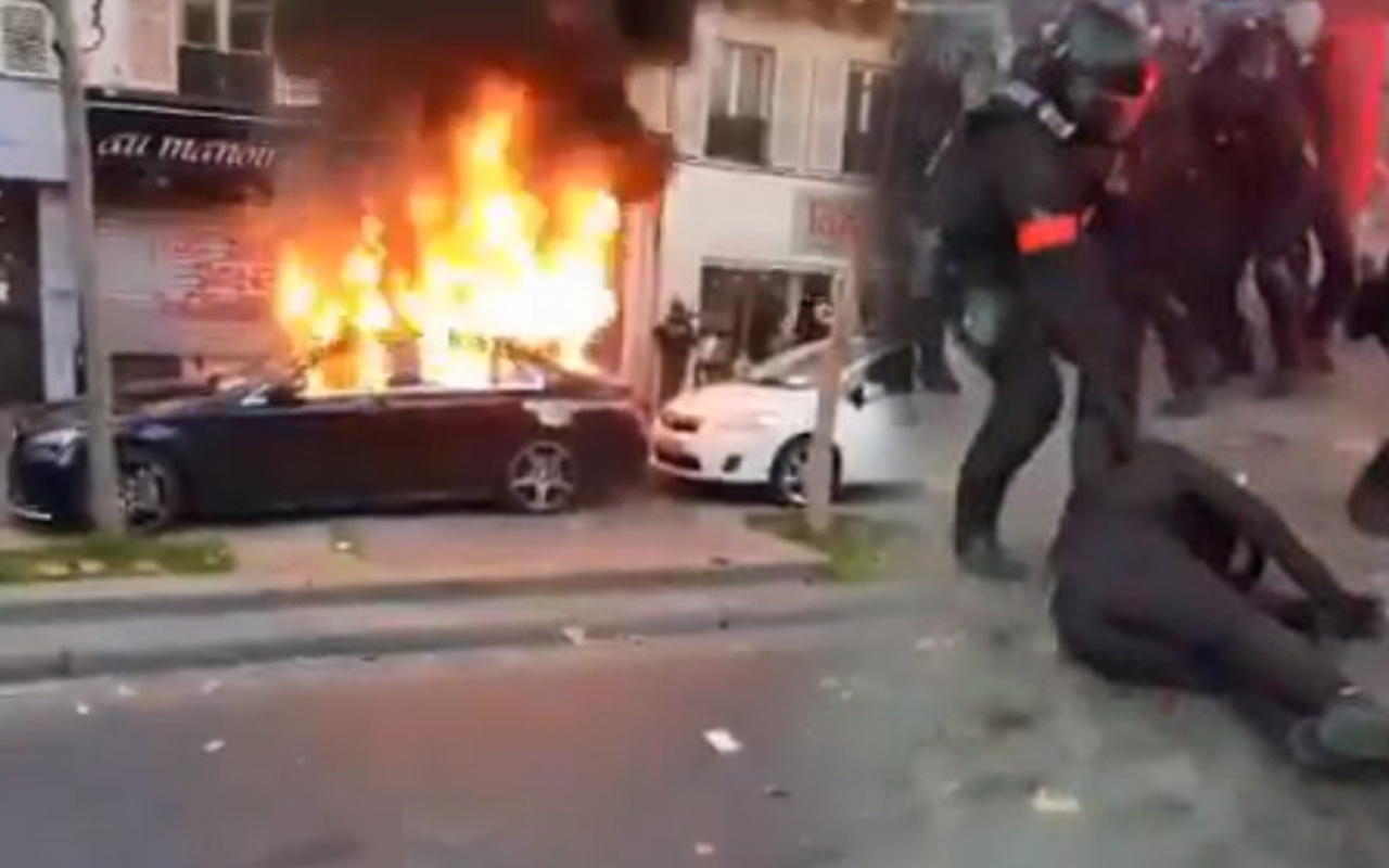 Fransa savaş alanı gibi Paris karıştı! Macron ve Bakanlara istifa çağrısında polise taşlı saldırı