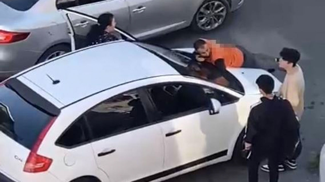 Sarıyer'de kadın sürücüye tepki gösteren motokurye kaputun üstüne yattı