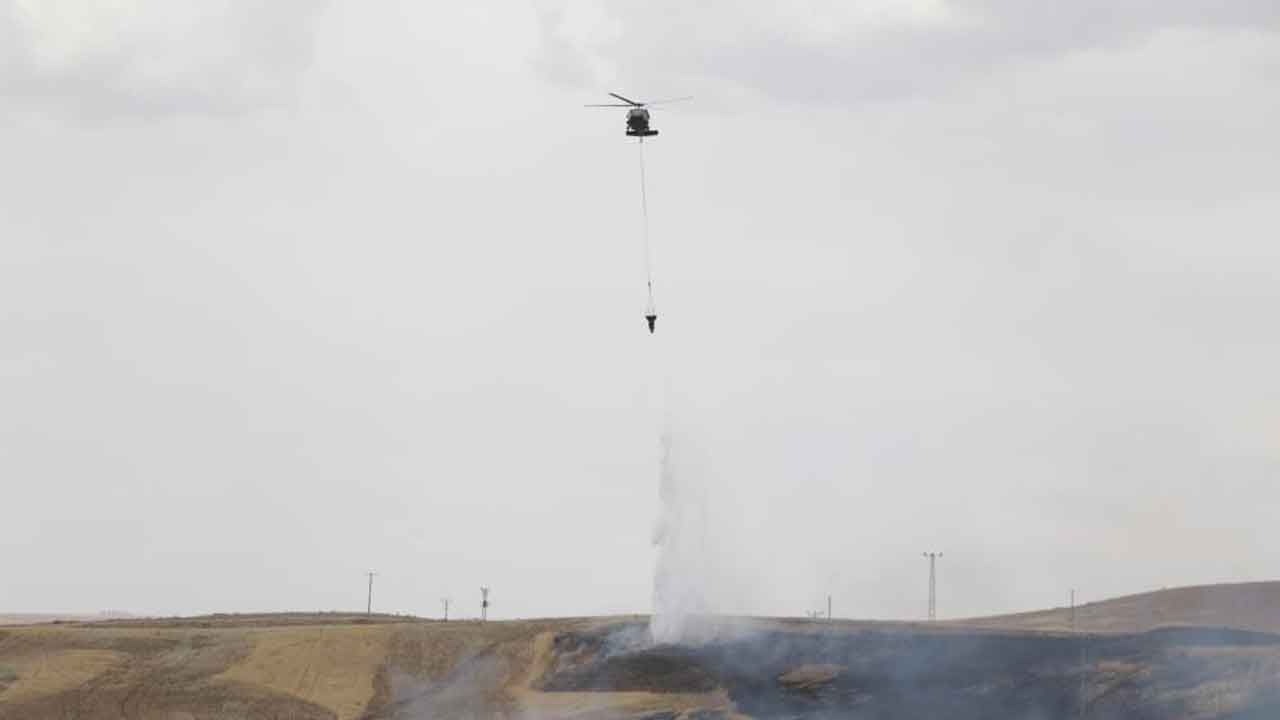 Diyarbakır'daki arazi kavgasında silahlar konuştu! Tarlada çıkan yangında helikopter destekli müdahale